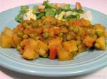 American Nepalese Potato Tomato and Pea Curry Dinner