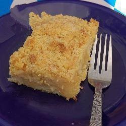 American Apple Cake from the Plate with Crumbs Dessert