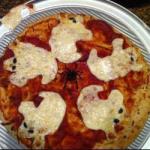 Halloween Pizza with Mozzarella Ghosts recipe