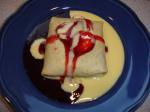 American Three Berry Crepes with Creme Anglaise and Strawberry Sauce Breakfast