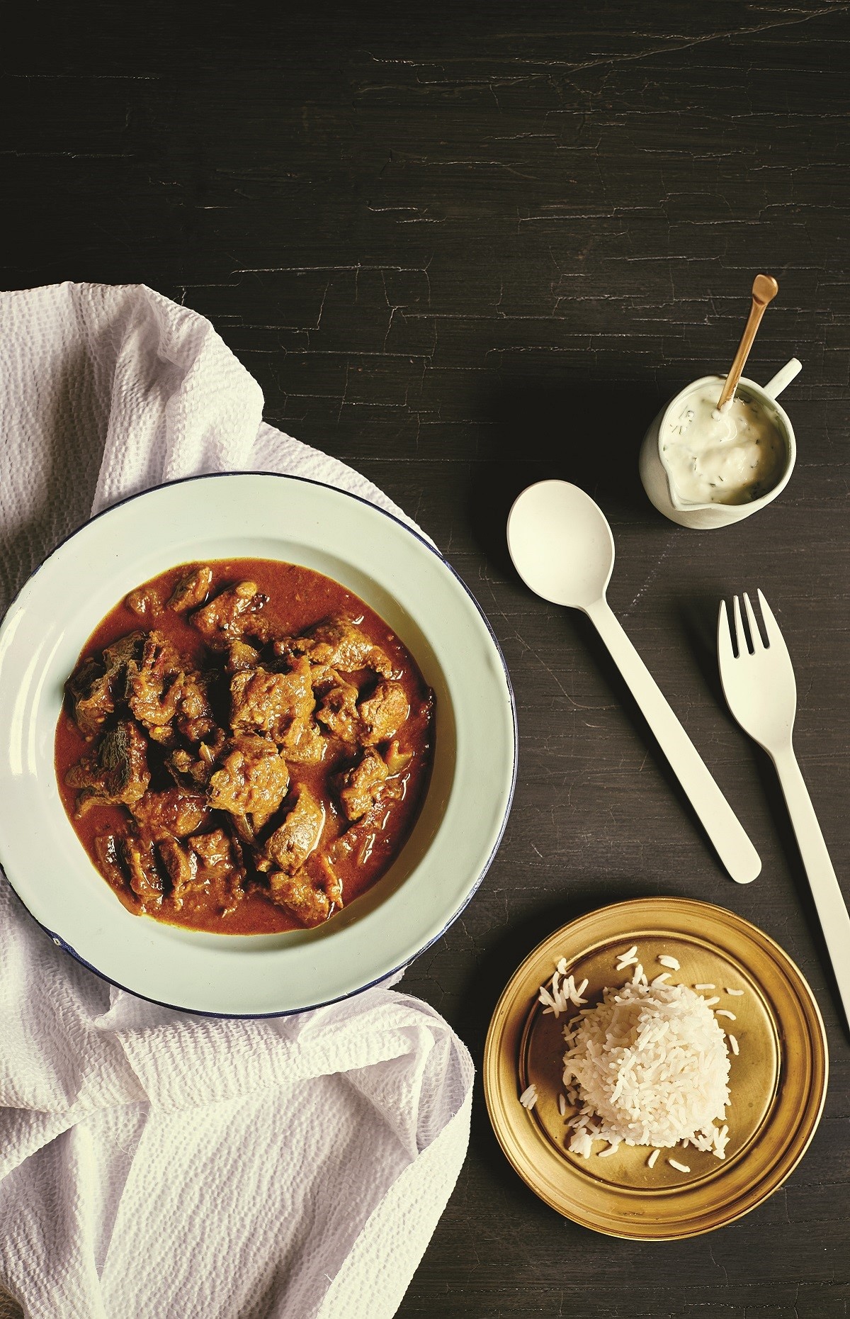 Indian Indianstyle Goat Curry with Mint Yoghurt Appetizer