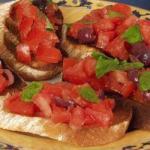 American Bruschetta of Tomatoes Olives and Basil Appetizer