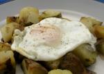 American Potato and Onion Hash with a Fried Egg for One Appetizer