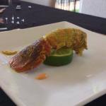 Dutch Tail of Lobster Curry Stuffed with Sausage on Its Green Lemon Appetizer
