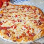 Italian Pizza with Salami and Tomato Dinner