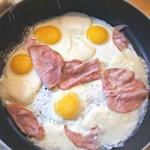 American Eggs to the Saucepan Together with Prosciutto and Mozzarella Appetizer