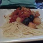 American Espaguettis with Tomato Sauce Olives and Seafood Dinner