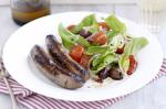 Spicy Sausages With Roasted Tomato Salad Recipe recipe