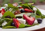 American Baby Spinach with Fresh Berries Pecans and Goat Cheese in Raspberry Vinaigrette Appetizer