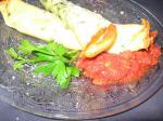 American Herbed Crepes With Ricotta Green Peppers and Tomato Sauce Appetizer