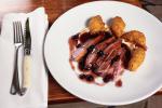 French Duck Breast with Sweet and Sour Blackcurrant Sauce Celeriac Puree and Pommes Dauphines Appetizer
