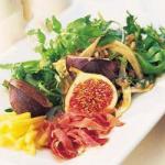 American Appetizer of Figs and Prosciutto Di Parma Trademark  with Rocket in Citrus Sauce Dinner