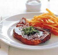 American Steaks with Herb Butter and Fries Dinner