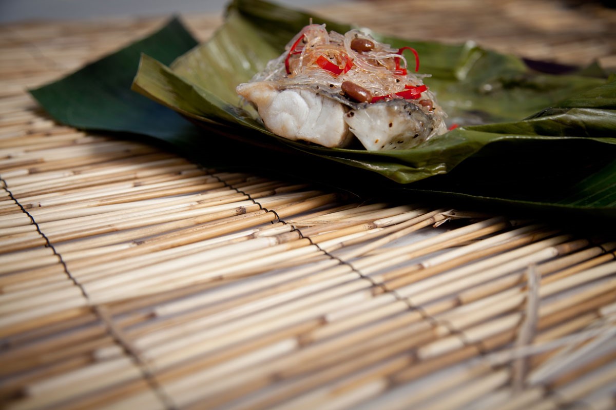 Chinese Barramundi Steamed in Banana Leaf with Salted Soy Beans Appetizer