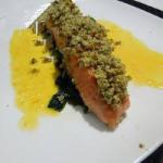 German Crispy Salmon with Herbs and Almonds on a Bed of Spinach and Creamy Sauce Mandarine Appetizer