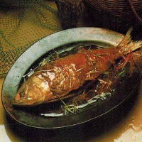Chinese Whole Baked Fish Served on a Hot Plate Appetizer