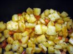 American Panbrowned Potatoes With Red Pepper and Whole Garlic Appetizer