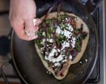 American Flatbread with Beetroot Leaves Feta and Pine Nuts Appetizer