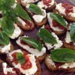 American Crostini with Goat Cheese Dried Tomatoes and Basil Appetizer